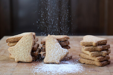 icing sugar drops on group of pastry biscuits