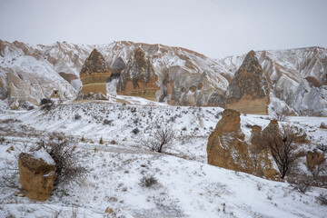 Stone pillars in the Valley of Love, winter day. Cappadocia, Turkey