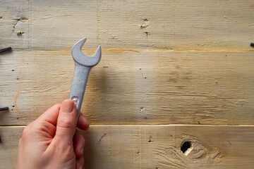 Wrench on wooden background