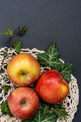 apples lie on a black background, space for text, flat view