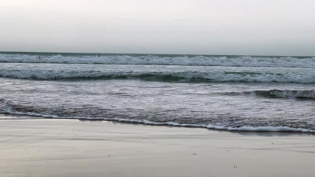 Sea waves crashing into the beach