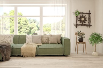 Stylish room in white color with sofa and summer landscape in window. Scandinavian interior design. 3D illustration