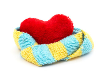 Red heart in a yellow and blue scarf.