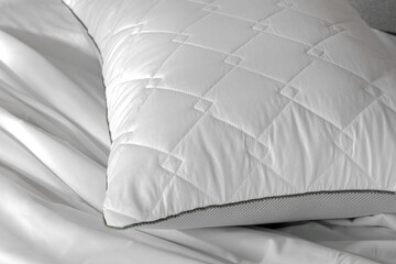 White orthopedic pillow on the bed. sleeping pillow