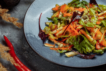 Sicilian salad with fennel, oranges, grapefruit and radicchio salad with balsamic dressing on a blue linen tablecloth. healthy summer italian food