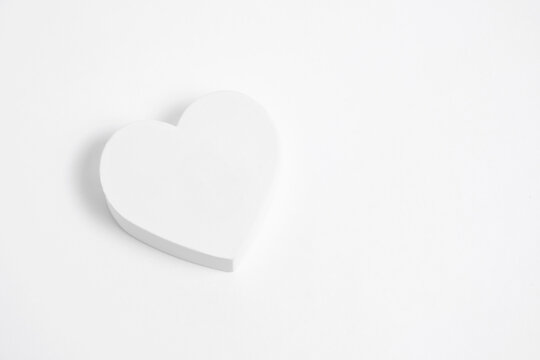 White heart on white background.