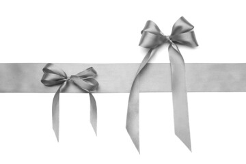 Beautiful silver bows with ribbon on white background