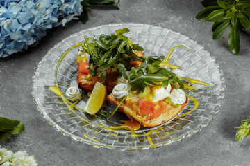 Eggs Benedict with avocado toast. Delicious and healthy breakfast. Healthy food concept