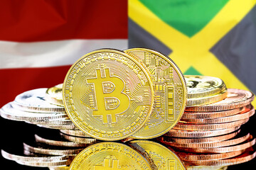Bitcoins on Latvia and Jamaica flag background