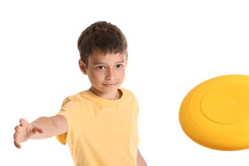 Funny little boy playing frisbee on white background