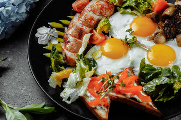 Full English breakfast with toast bread, chicken egg, mustard sauce, champignons, salad mix, cheese cream, sweet pepper