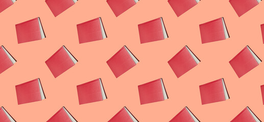 Seamless pattern with red book on a pink background.