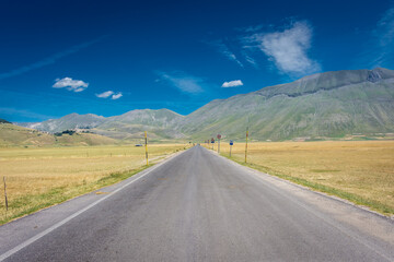 Highway road through the Valley of Castelluccio di Norcia, Umbria Italy
