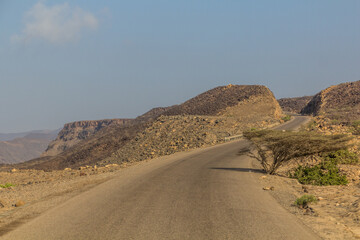Fototapeta na wymiar RN9 road through the desert landscape of Djibouti