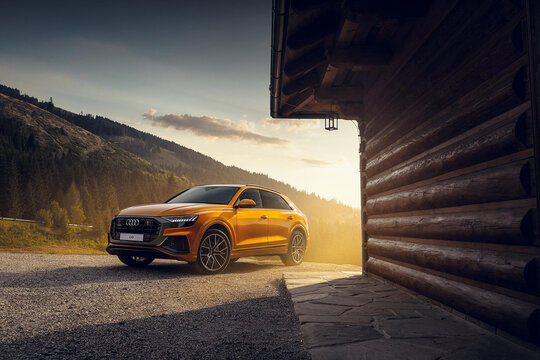 Trencin, Slovakia - August 2018: Audi Q8 in orange color in the mountains.