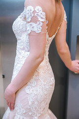 Beautiful fashionable bride in a long white dress