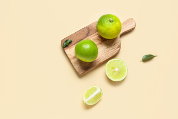 Wooden board with ripe bergamot fruits on color background