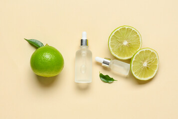 Bottles of essential oil and ripe bergamot fruits on color background