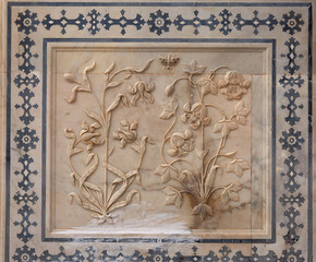 Designs and carving all along the walls of Sheesh Mahal of  ancient Amer fort of Jaipur, India