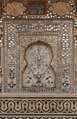 Intricate design and embedded mirrors inside Sheesh Mahal of  ancient Amer fort of Jaipur, India