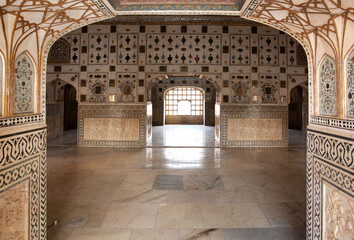 Intricate design and embedded mirrors in Sheesh Mahal of  ancient Amer fort of Jaipur, India