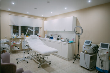 The interior of the massage and cometology salon, massage table. Nobody.