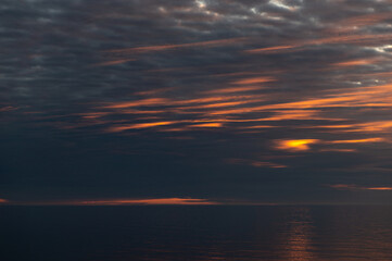 Meditation ocean and sky background. Colorful horizon over the water. Water surface. Abstract cloudscape over the sea, sunrise shot