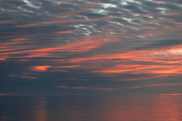 Meditation ocean and sky background. Colorful horizon over the water. Water surface. Abstract cloudscape over the sea, sunrise shot