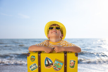 Happy child enjoying the sun on summer vacation
