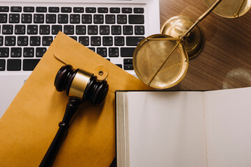 Male lawyer working with contract papers and wooden gavel on tabel in courtroom. justice and law ,attorney, court judge, concept.