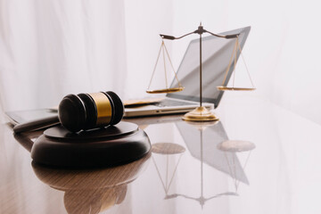 Male lawyer working with contract papers and wooden gavel on tabel in courtroom. justice and law ,attorney, court judge, concept.