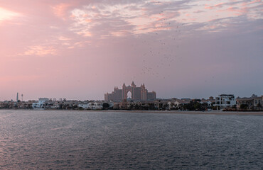 Naklejka premium Palm Jumeirah sunset with the Palm Hotel in Dubai viewpoint Royal Central the Palm