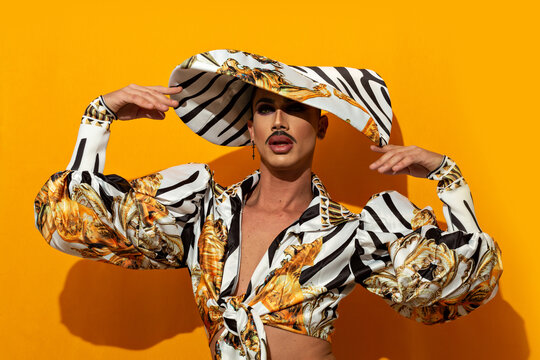 Portrait of Marvellous Drag Queen Diva with yellow background