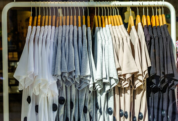 clothes hanging at a clothes rail