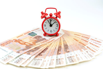 alarm clock on Russian money