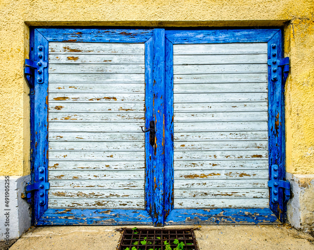 Poster old wooden door at a historic building