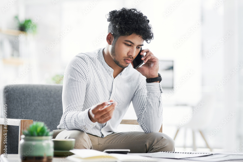 Aufkleber finalising the last of is big plans. shot of a young businessman talking on a cellphone while going 