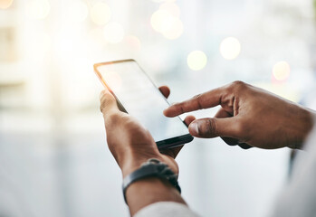 Communication at the touch of a button. Studio shot of an unrecognizable young man using his...