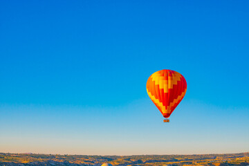 Hot air balloon on the sky. Cappadocia background photo.