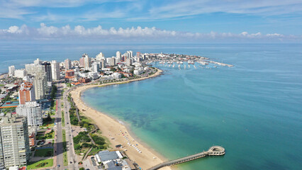 Aerial view of Punta del Este Playa Mansa beach with modern buildings and boats. Punta del Este,...
