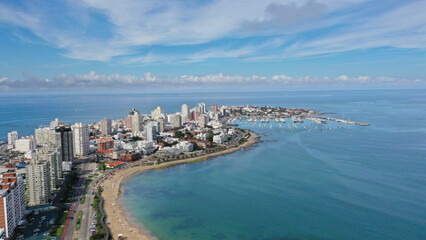Aerial view of Punta del Este Playa Mansa beach with modern buildings and boats. Punta del Este,...