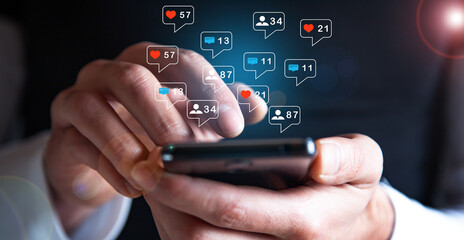 Hand hold smartphone play social media with communication icon