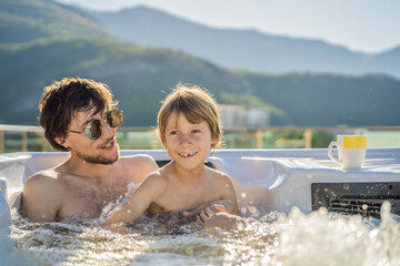 Portrait of young carefree happy smiling happy family relaxing at hot tub during enjoying happy...