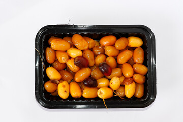 Arabic Fresh Yellow And Red Date Fruits In A Black Square Plate