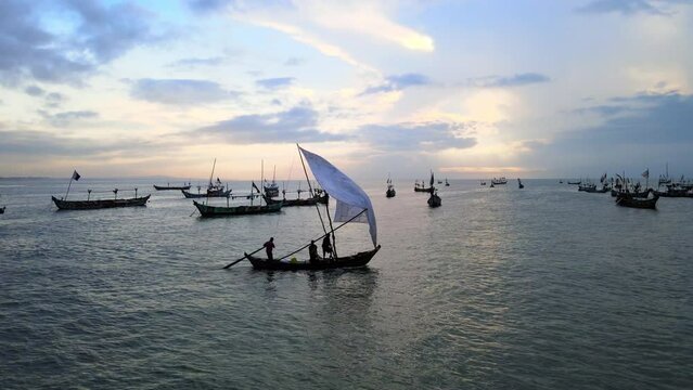 Silhouetted boats along the coast of Winneba in Ghana