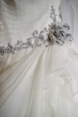 Close-up of a silver rose of a wonderful wedding dress