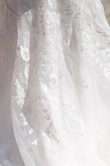Fototapeta na wymiar Macro view classical white wedding dress textile fabric with tiny detailed flowers pattern
