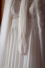 Close up view white wedding dress. Classic wedding dress styles concept