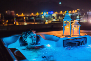 Portrait embarrassed man relaxing at hot tub to whom the woman did not come on a date. February 14...
