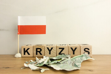 Word kryzys which means crisis in Polish with flag of Poland and torn money